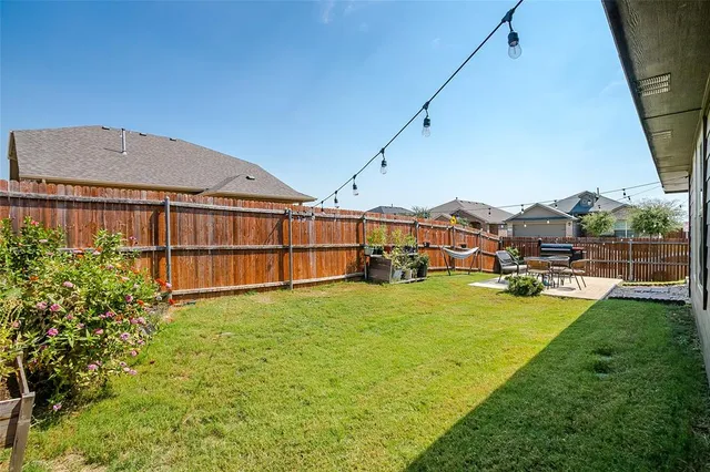 a view of a house with swimming pool yard and outdoor seating