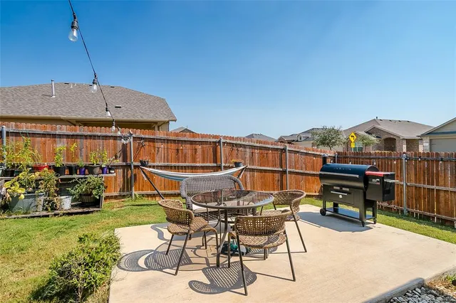 a view of a terrace with furniture and garden