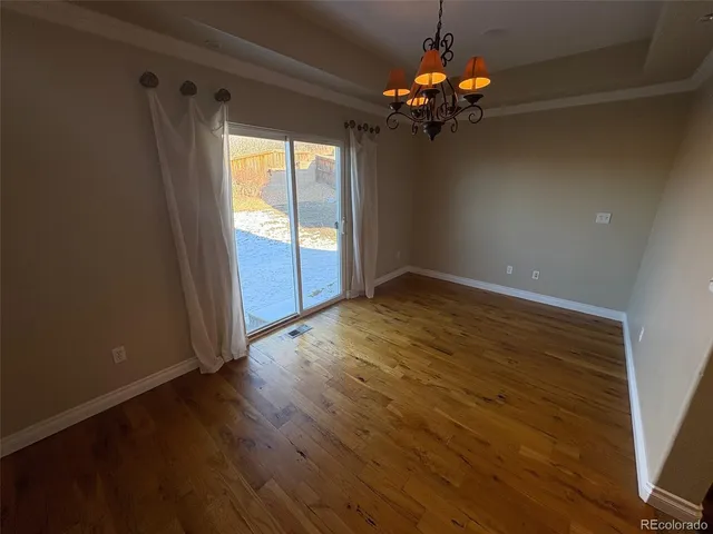 a room with furniture and wooden floor