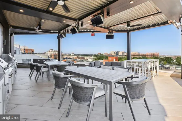 a view of a swimming pool with outdoor seating
