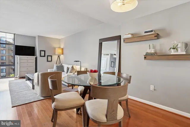a view of a dining room with furniture and wooden floor