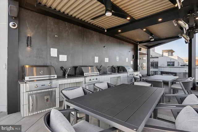 a living room with lots of furniture and white appliances