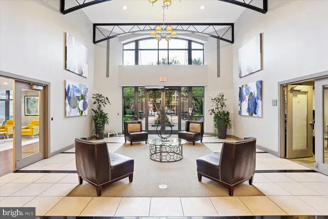 a living room with fireplace furniture and a window