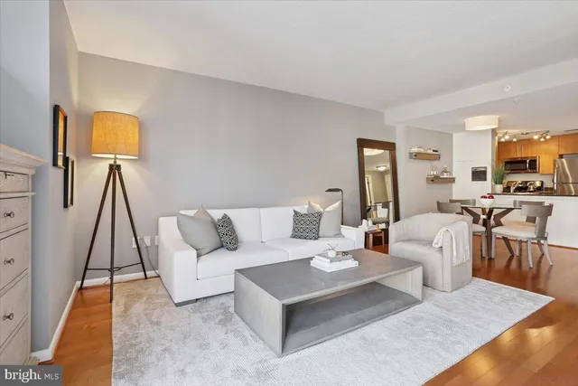 a living room with furniture and a table