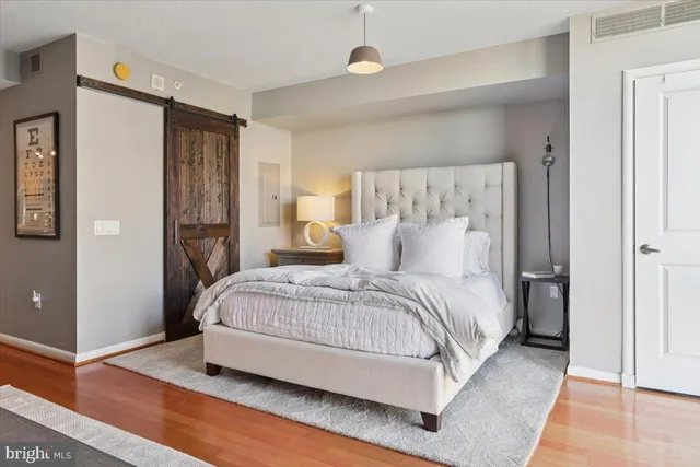 a spacious bedroom with a bed and a walk in closet