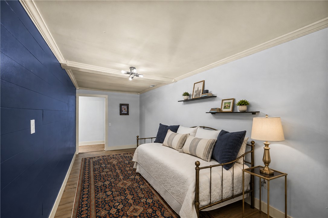 203 Muller Road Walhalla, SC 29691 - Photo 18 of 34 Elegant crown molding and rich wood flooring define this versatile interior space.