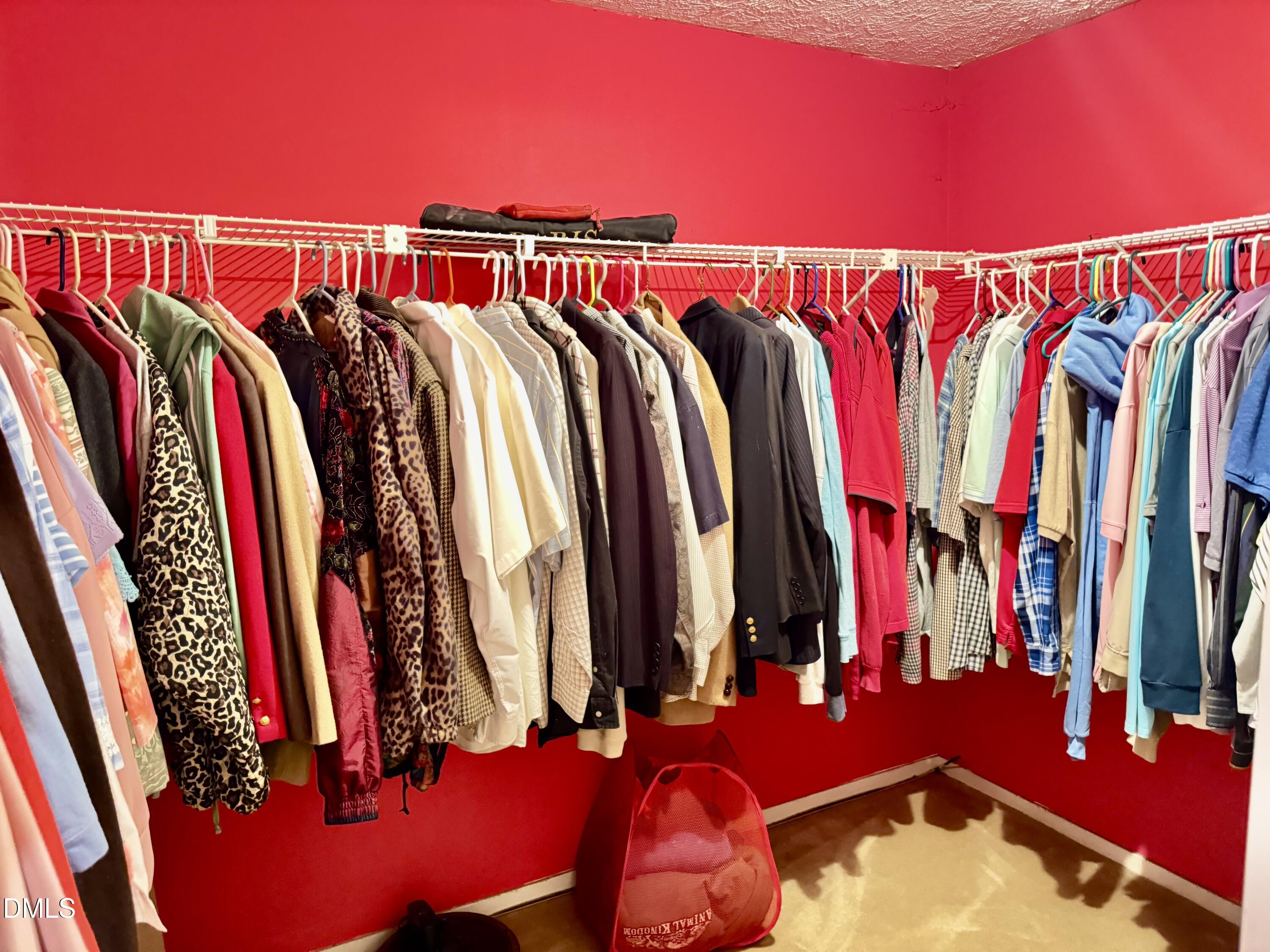 84 Wintergreen Road Henderson, NC 27537 - Photo 24 of 49 a view of walk in closet with clothes and shoes