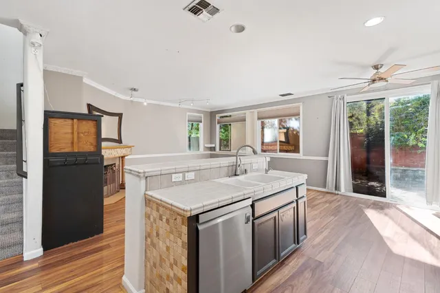 a kitchen with a sink stove and refrigerator