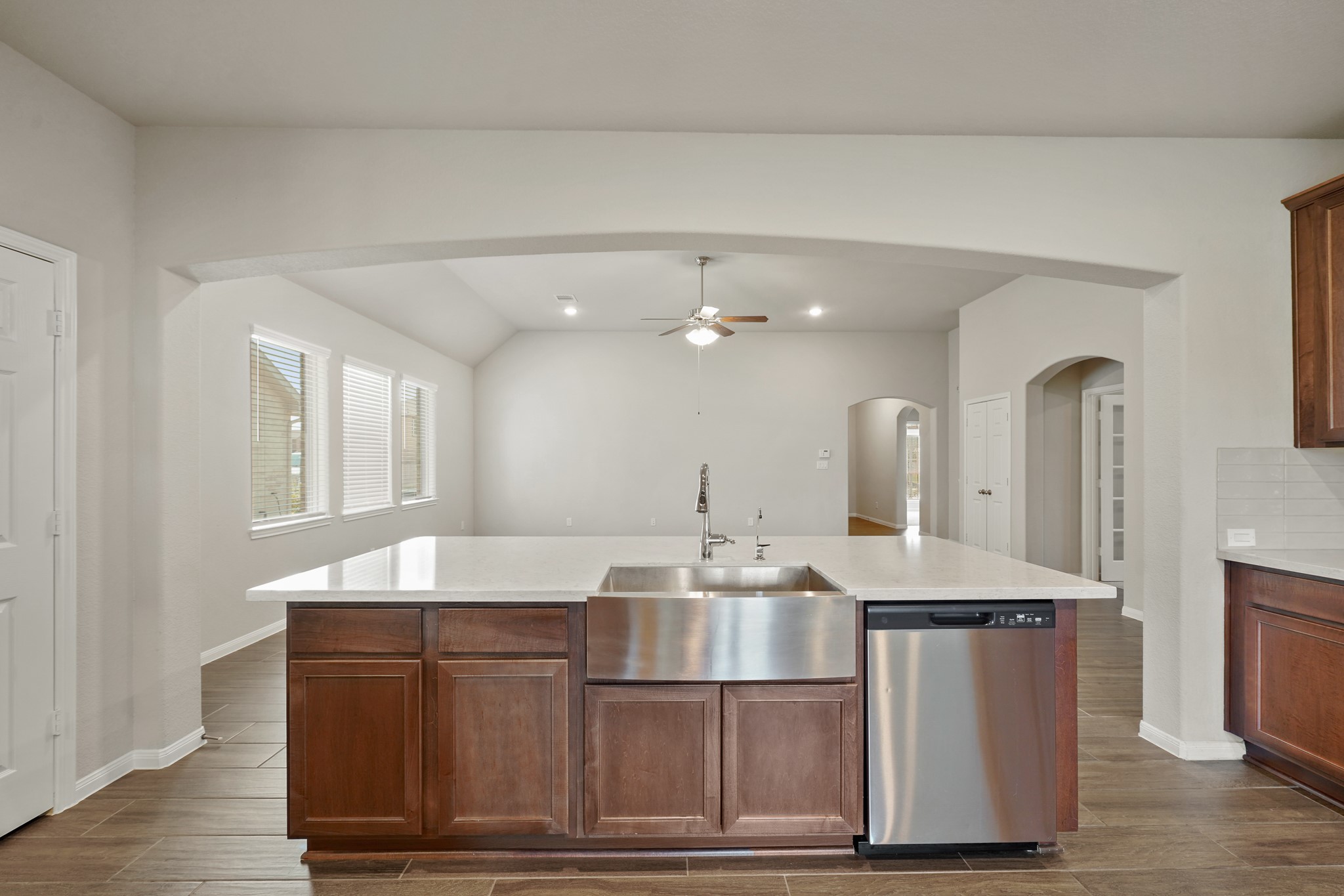 6010 Kolle Drive Rosenberg, TX 77471 - Photo 12 of 45 a room with granite countertop a sink cabinets and wooden floor
