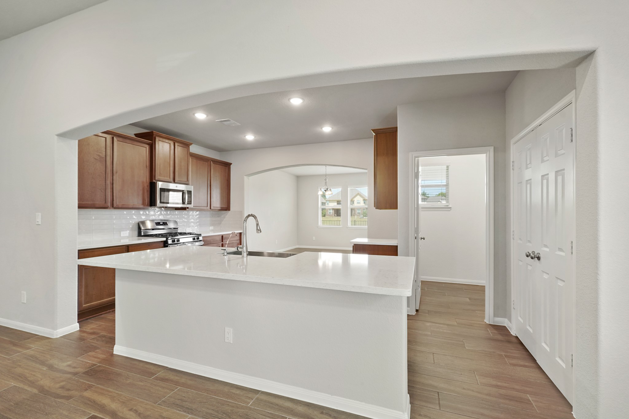 6010 Kolle Drive Rosenberg, TX 77471 - Photo 16 of 45 a large kitchen with kitchen island a sink appliances