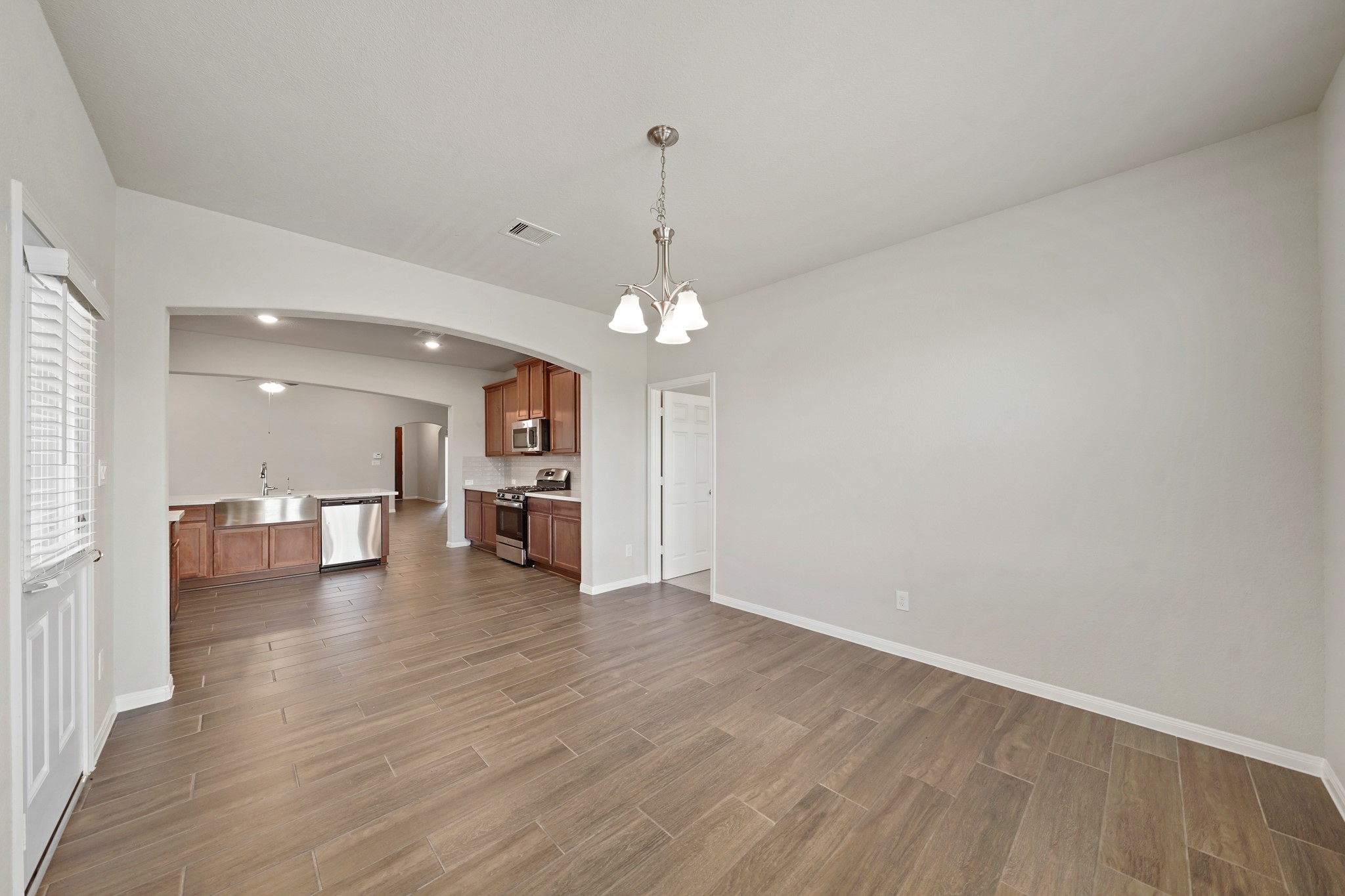 6010 Kolle Drive Rosenberg, TX 77471 - Photo 18 of 45 a view of a living room and kitchen with a sink