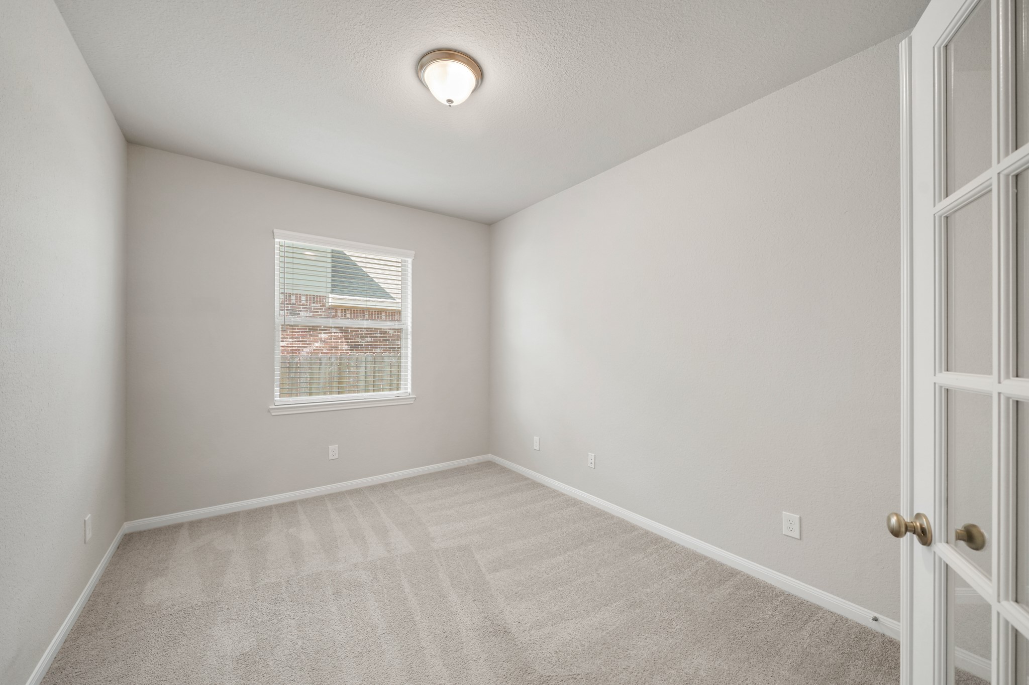 6010 Kolle Drive Rosenberg, TX 77471 - Photo 22 of 45 an empty room with windows