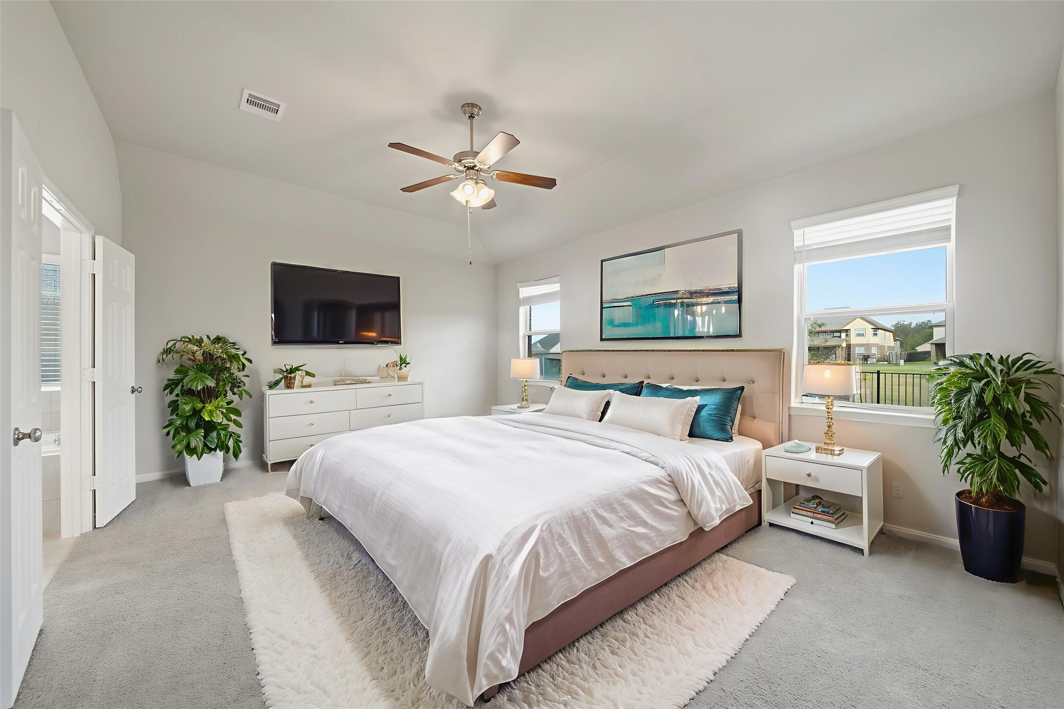 6010 Kolle Drive Rosenberg, TX 77471 - Photo 23 of 45 a spacious bedroom with a bed and a chandelier