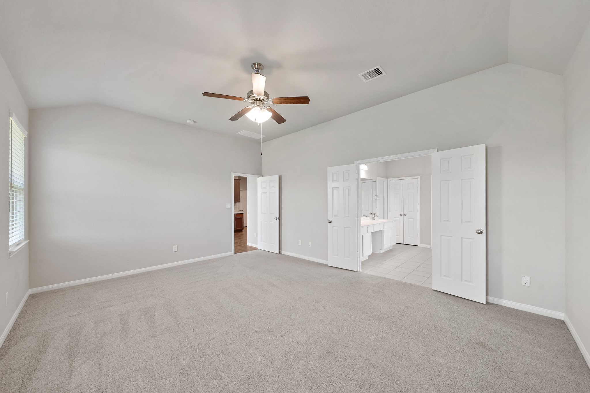 6010 Kolle Drive Rosenberg, TX 77471 - Photo 24 of 45 a view of an empty room with a ceiling fan and window