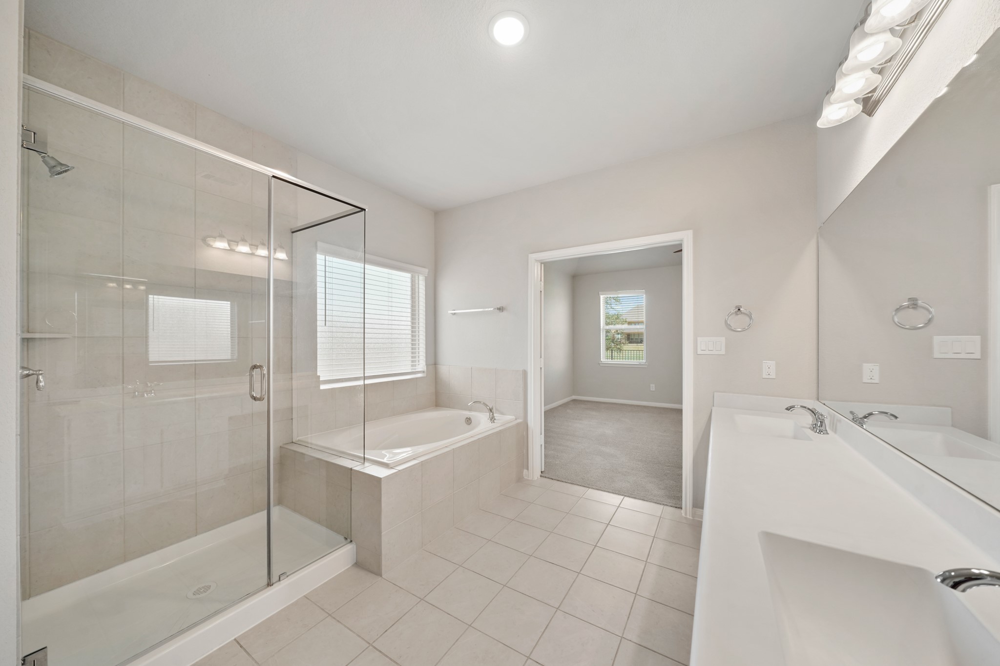 6010 Kolle Drive Rosenberg, TX 77471 - Photo 28 of 45 a spacious bathroom with a tub shower and sink