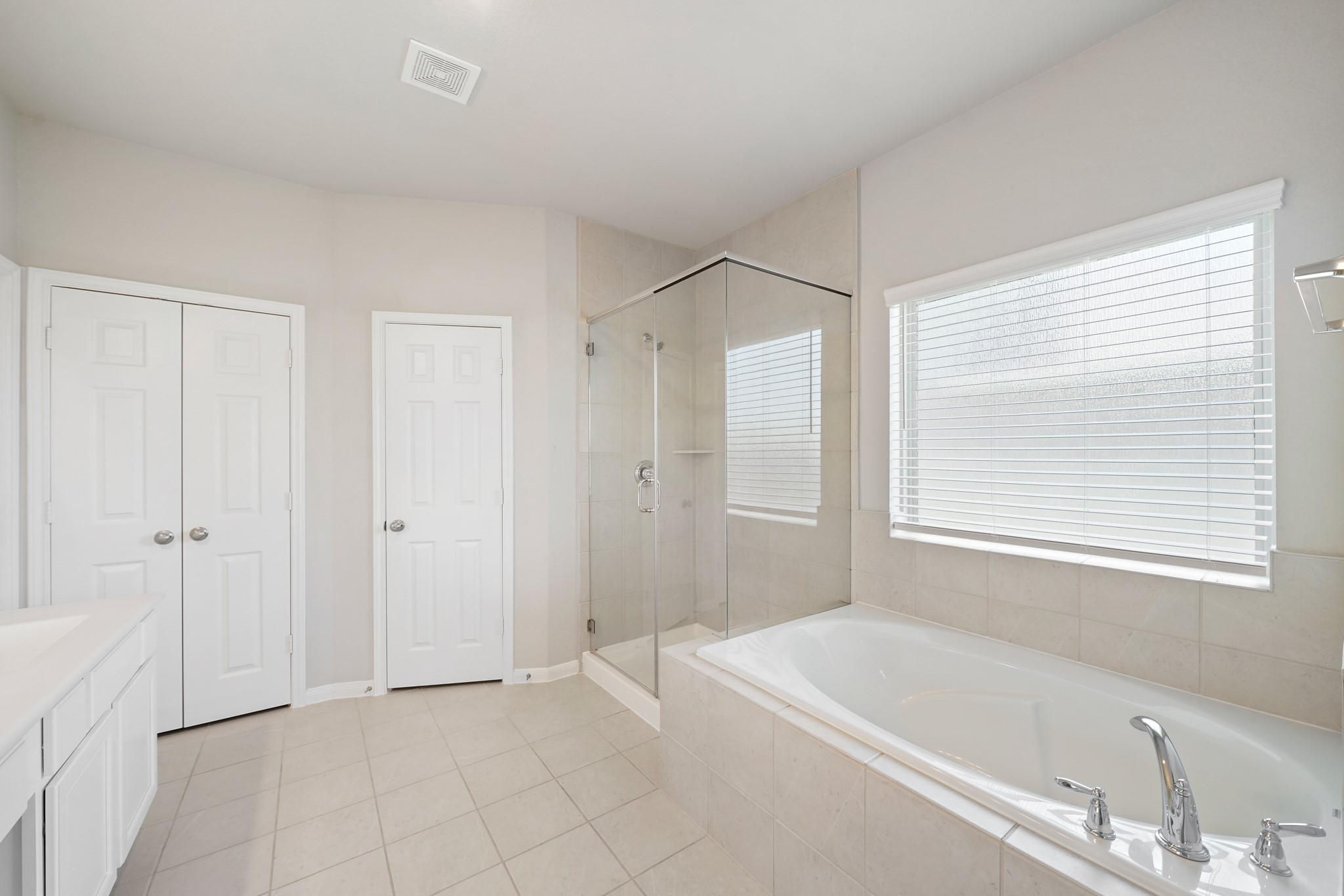 6010 Kolle Drive Rosenberg, TX 77471 - Photo 29 of 45 a bathroom with a bathtub a shower and a sink