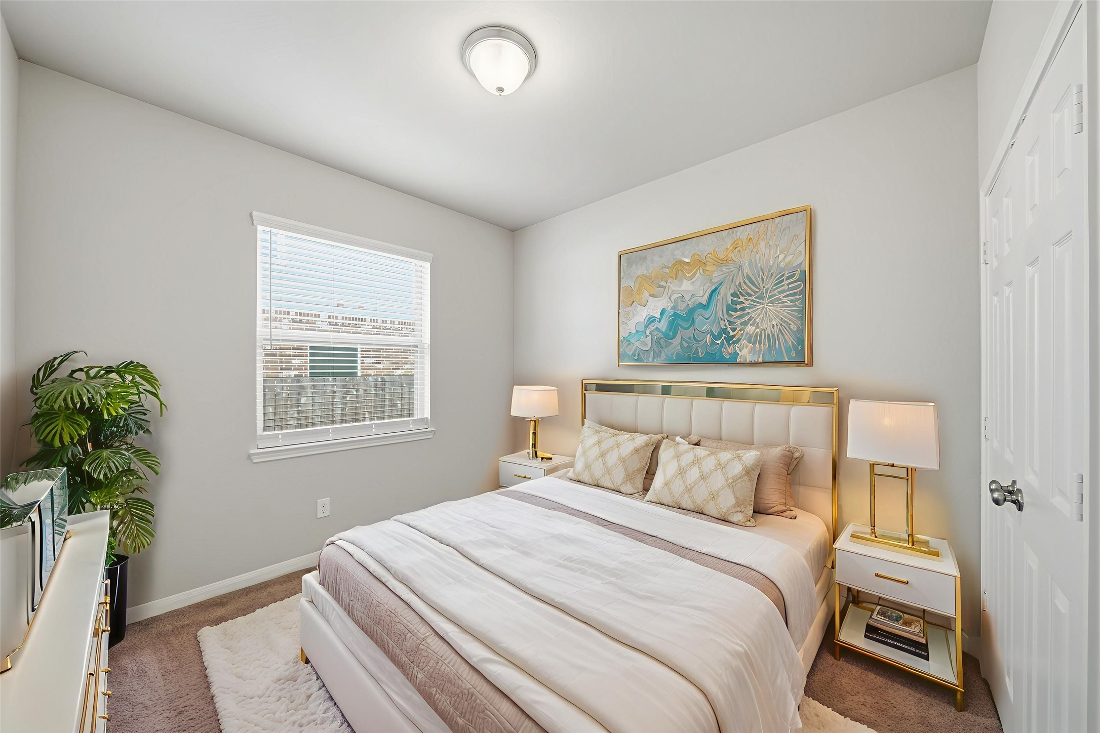 6010 Kolle Drive Rosenberg, TX 77471 - Photo 36 of 45 a bedroom with a large bed and a potted plant