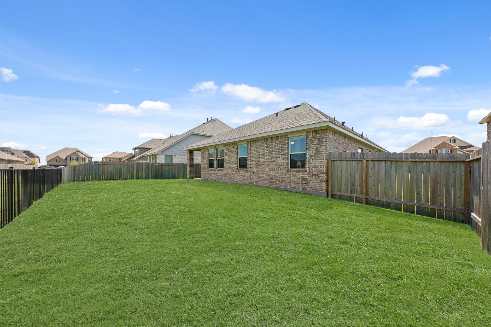 6010 Kolle Drive Rosenberg, TX 77471 - Photo 44 of 45 a view of a backyard with plants and large trees