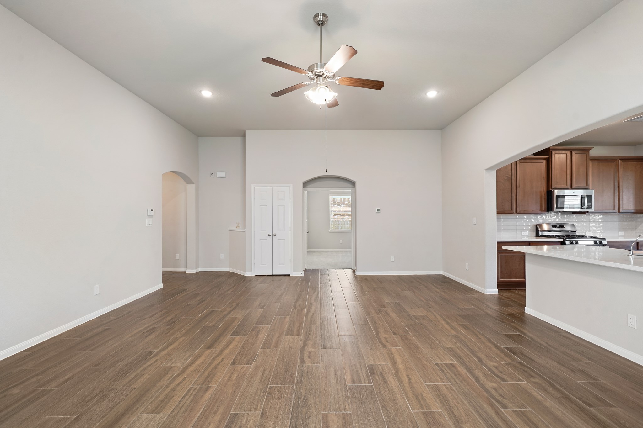 6010 Kolle Drive Rosenberg, TX 77471 - Photo 10 of 45 a view of kitchen with sink and wooden floor