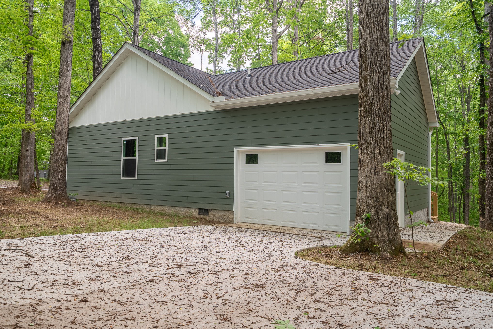 32 Periwinkle Path Leoma, TN 38468 - Photo 4 of 28 a view of a house with a yard and garage