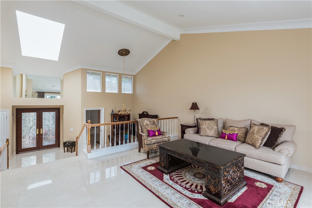 a living room with furniture and a rug