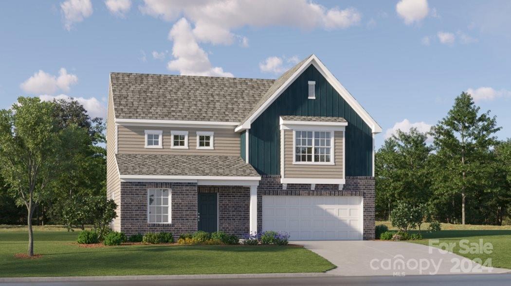 649 Mile Crk Road, Unit 92 Edgemoor, SC 29712 - Photo 1 of 1 a front view of a house with a yard and garage