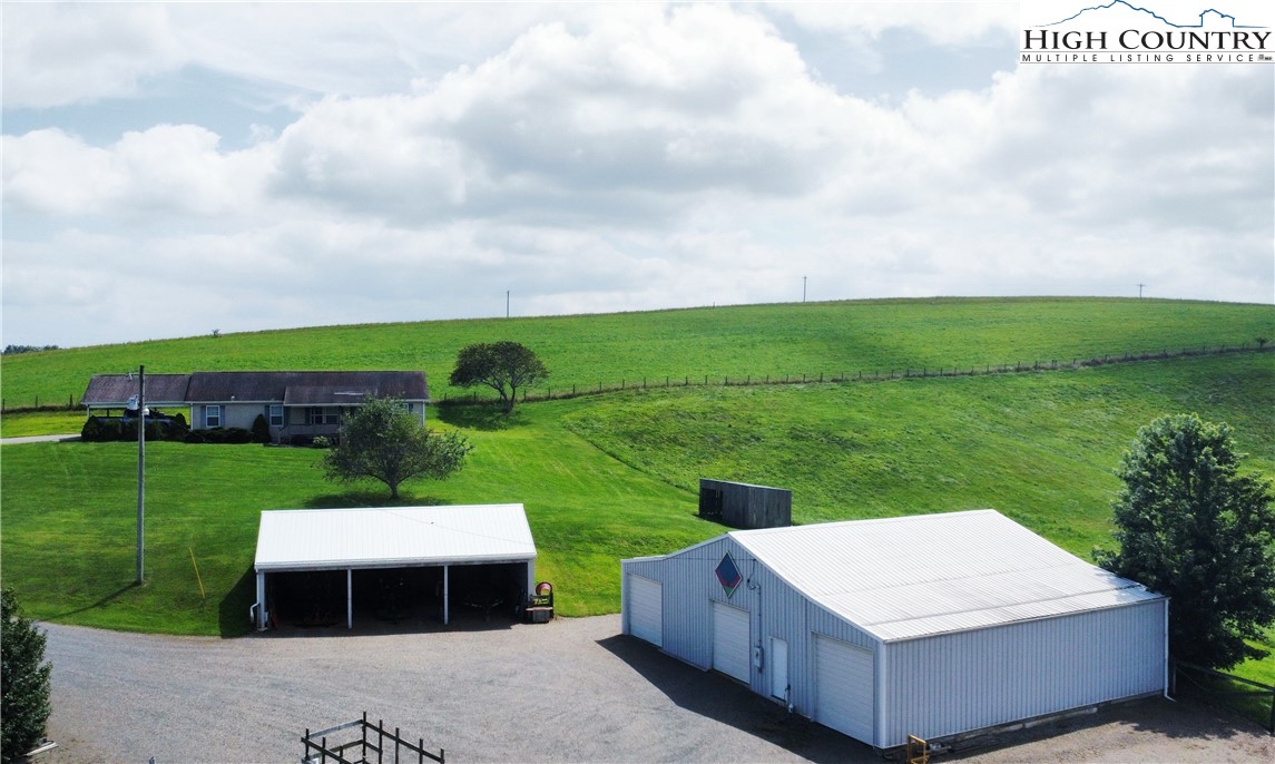 a view of a table and chairs in the garden