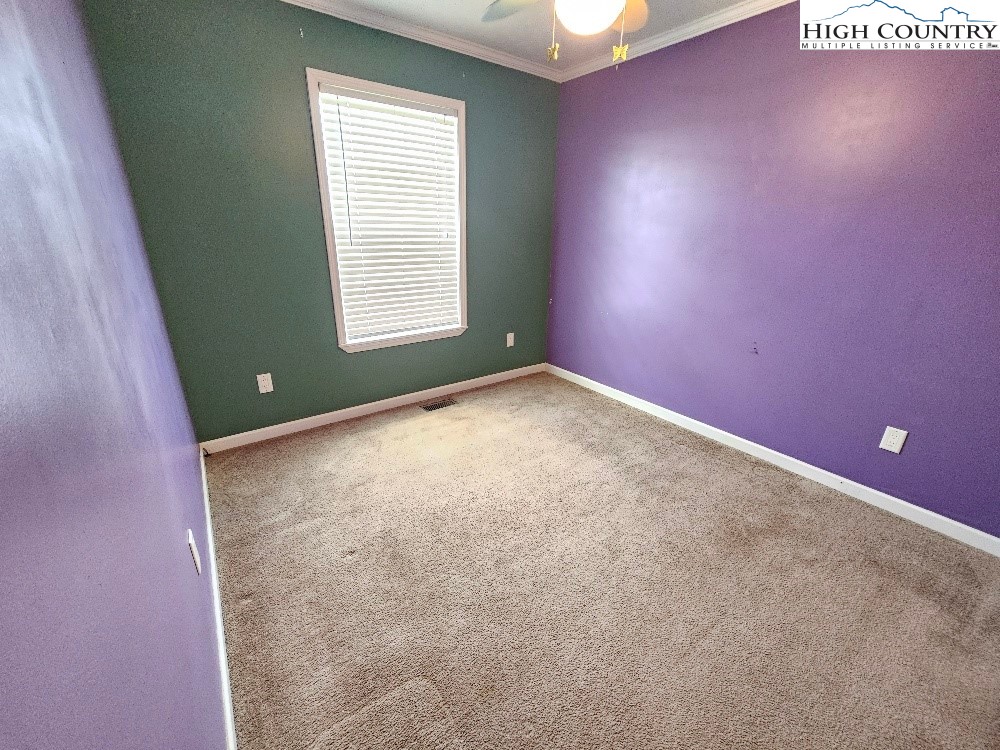 459 Edwards Road Ennice, NC 28623 - Photo 16 of 36 an empty room with windows