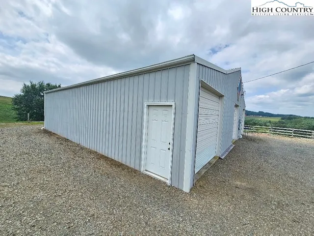a backyard of a house with outdoor seating