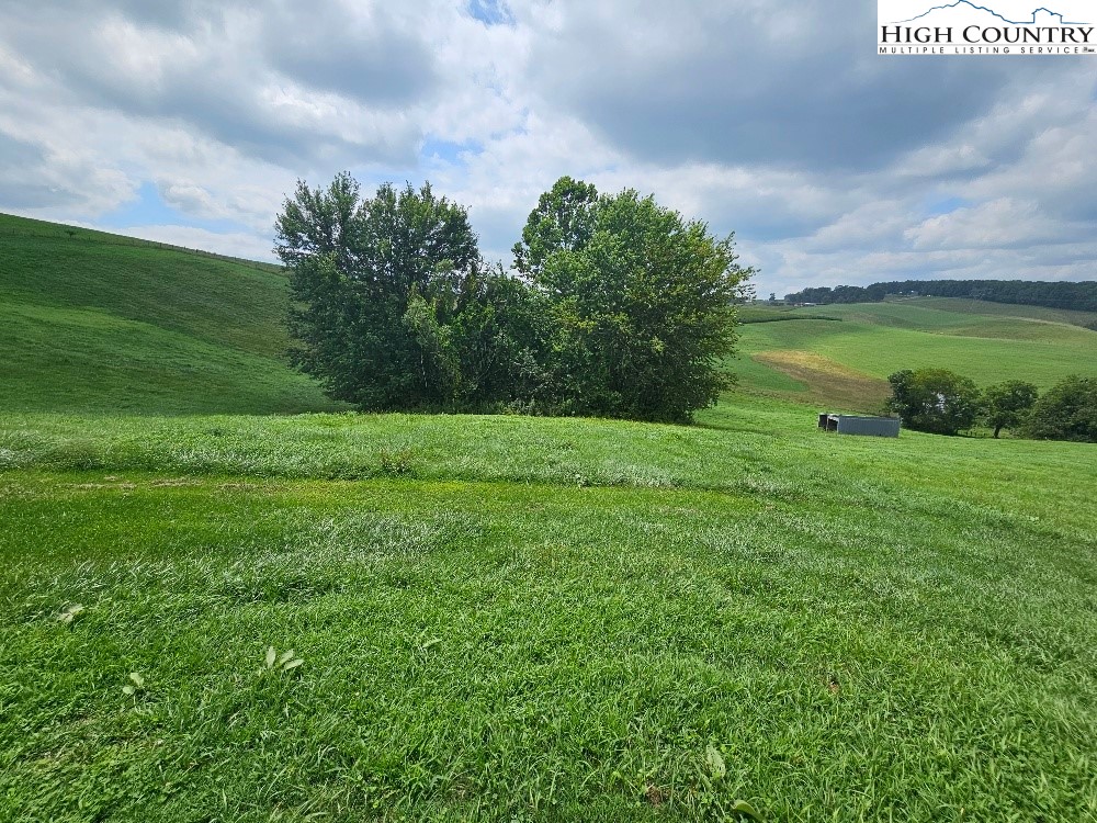 459 Edwards Road Ennice, NC 28623 - Photo 31 of 36 a view of a lake with a big yard