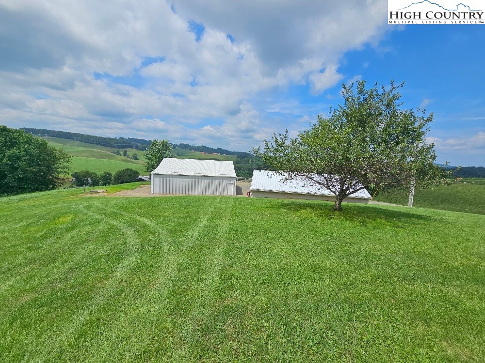 459 Edwards Road Ennice, NC 28623 - Photo 4 of 36 a view of a garden and basketball court