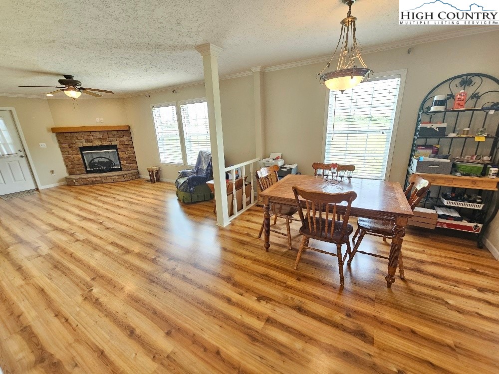 459 Edwards Road Ennice, NC 28623 - Photo 6 of 36 a view of a dining room with furniture window and wooden floor