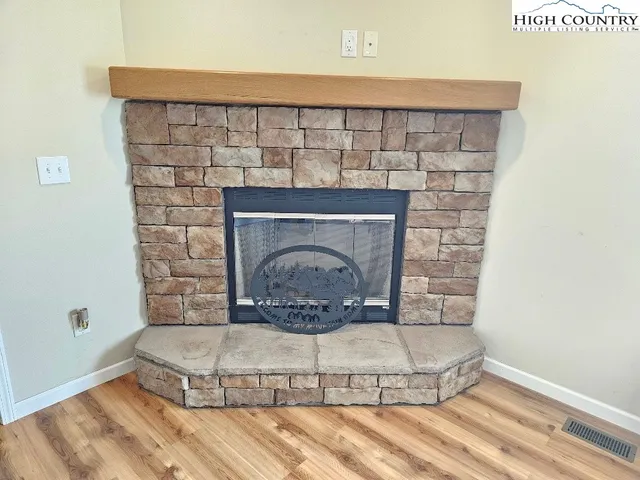 a living room with a fireplace