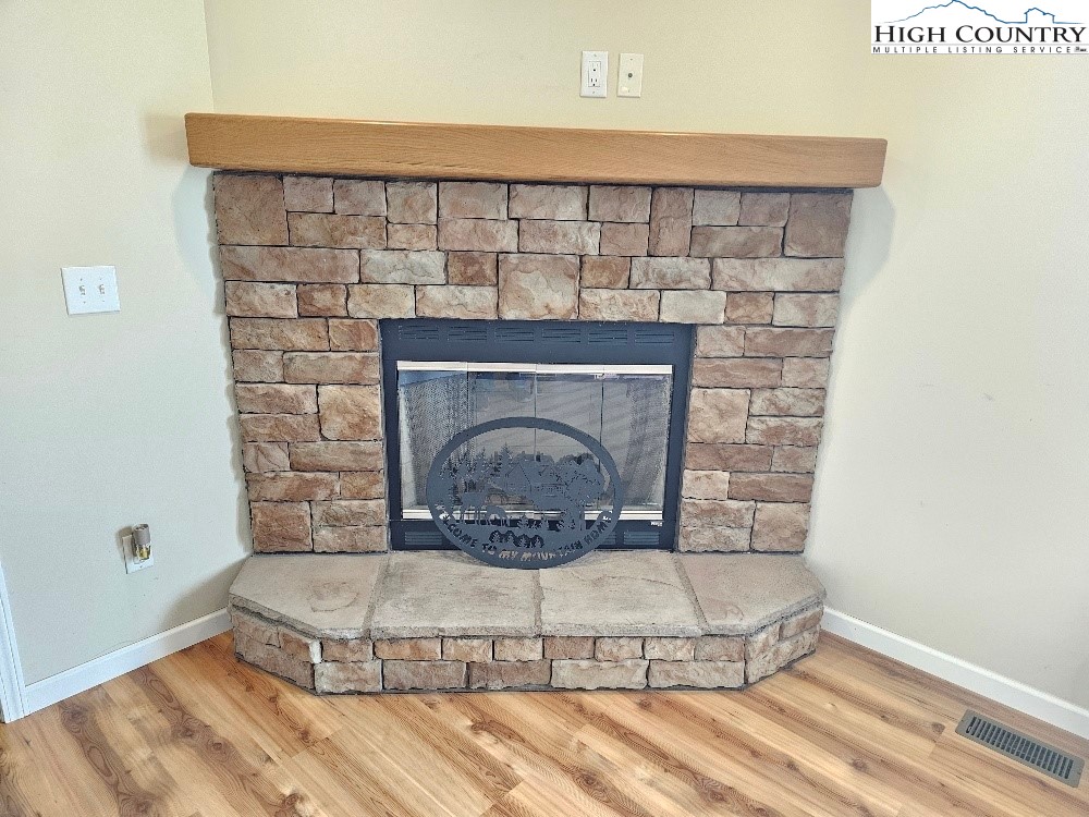 459 Edwards Road Ennice, NC 28623 - Photo 7 of 36 a living room with a fireplace