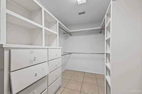 a view of an empty walk in closet