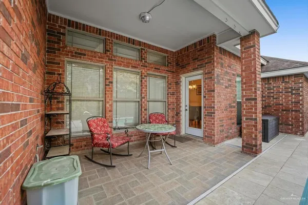 a outdoor space with a couch and chairs