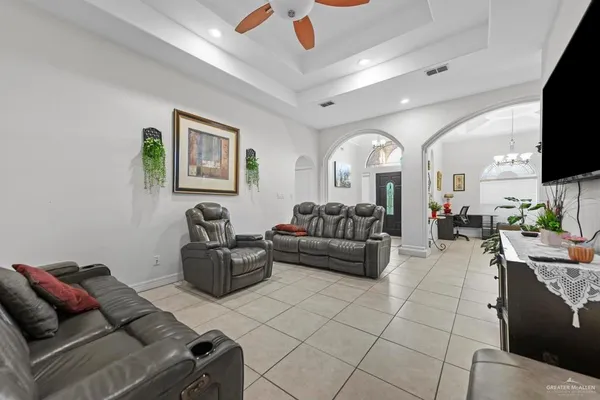 a living room with furniture and a flat screen tv