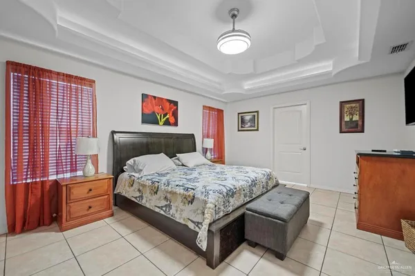 a bedroom with a bed and dresser