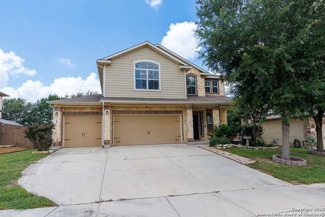 a view of a white house with a outdoor space