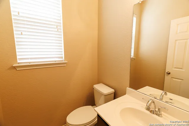 a bathroom with a sink and a toilet