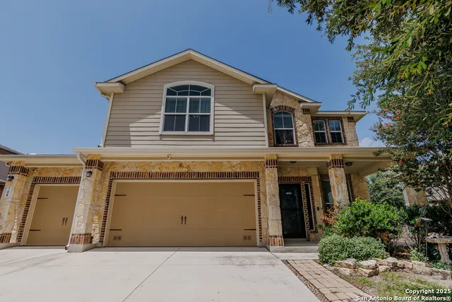 a front view of a house with a garage