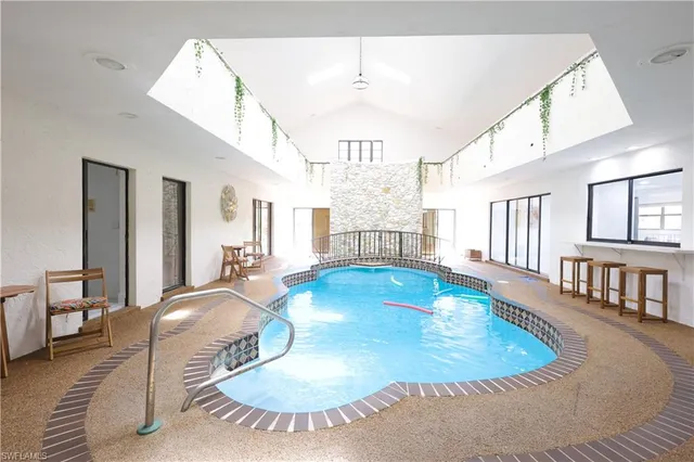 a view of a livingroom with furniture wooden floor and a chandelier