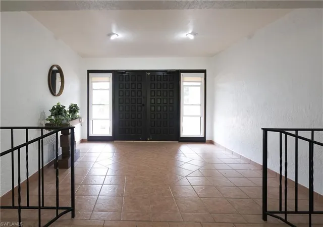 a view of entryway with a window and stairs