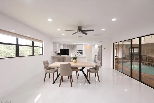 a view of a dining room with furniture window and outside view