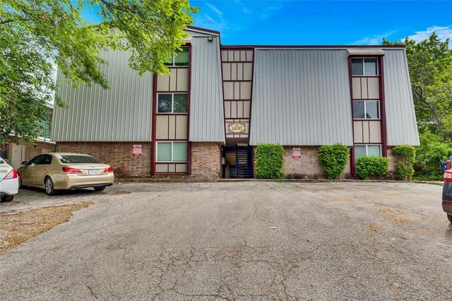 a view of a car park in front of a building