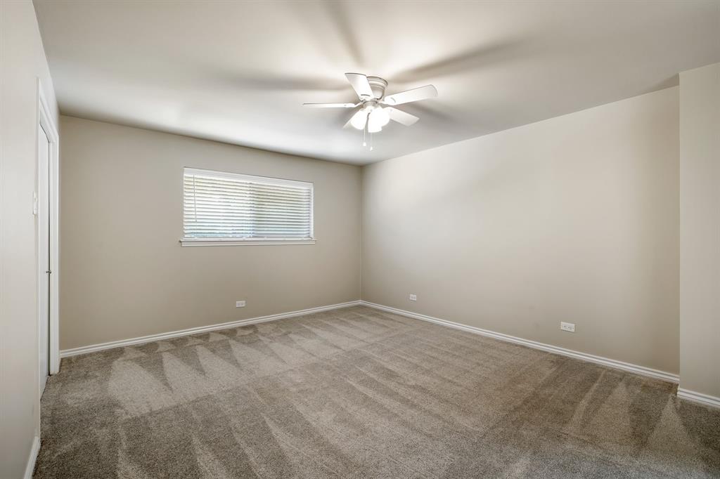 5921 Preston Road University Park, TX 75205 - Photo 17 of 37 an empty room with a window and a fan