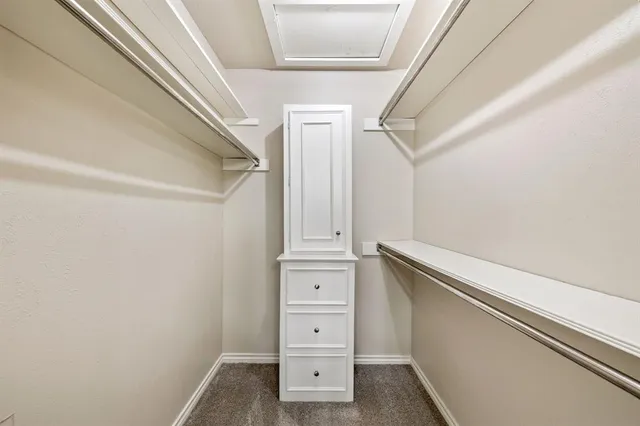 a bathroom with a granite countertop sink a toilet and a mirror
