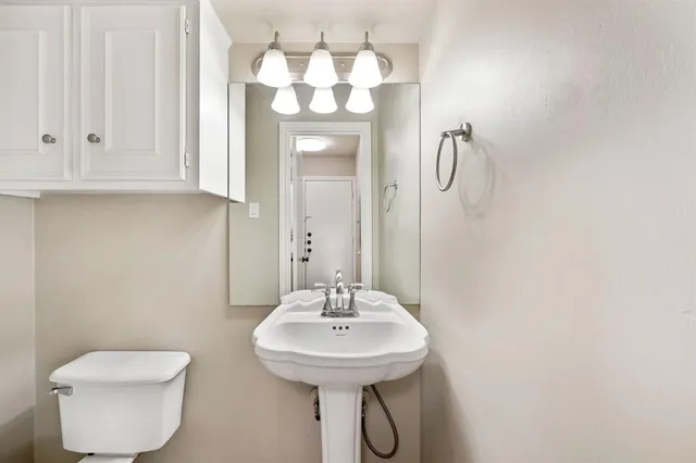 a view of a balcony with wooden stairs