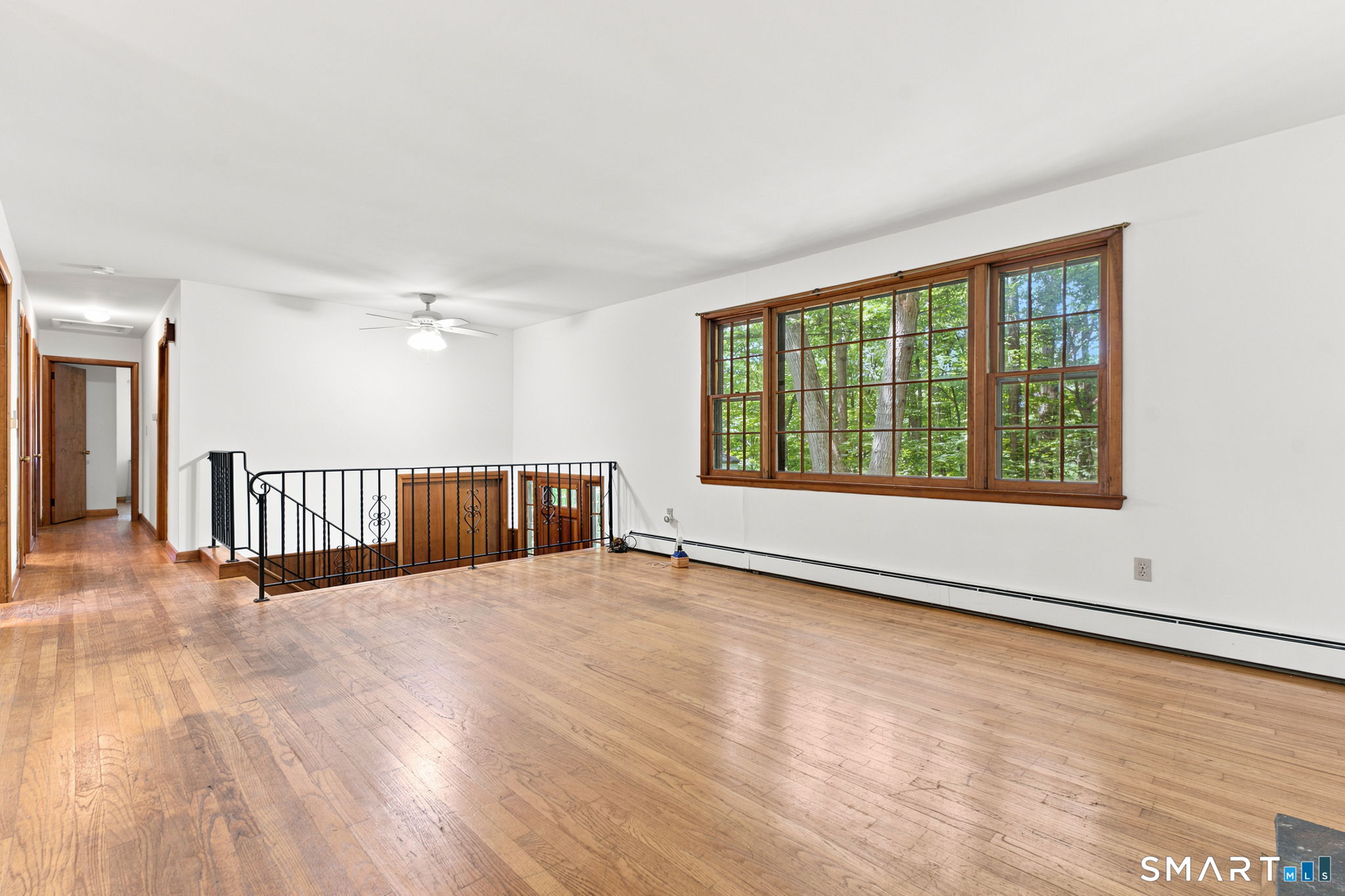 448 Mixville Road Cheshire, CT 06410 - Photo 4 of 32 wooden floor in an empty room with a window