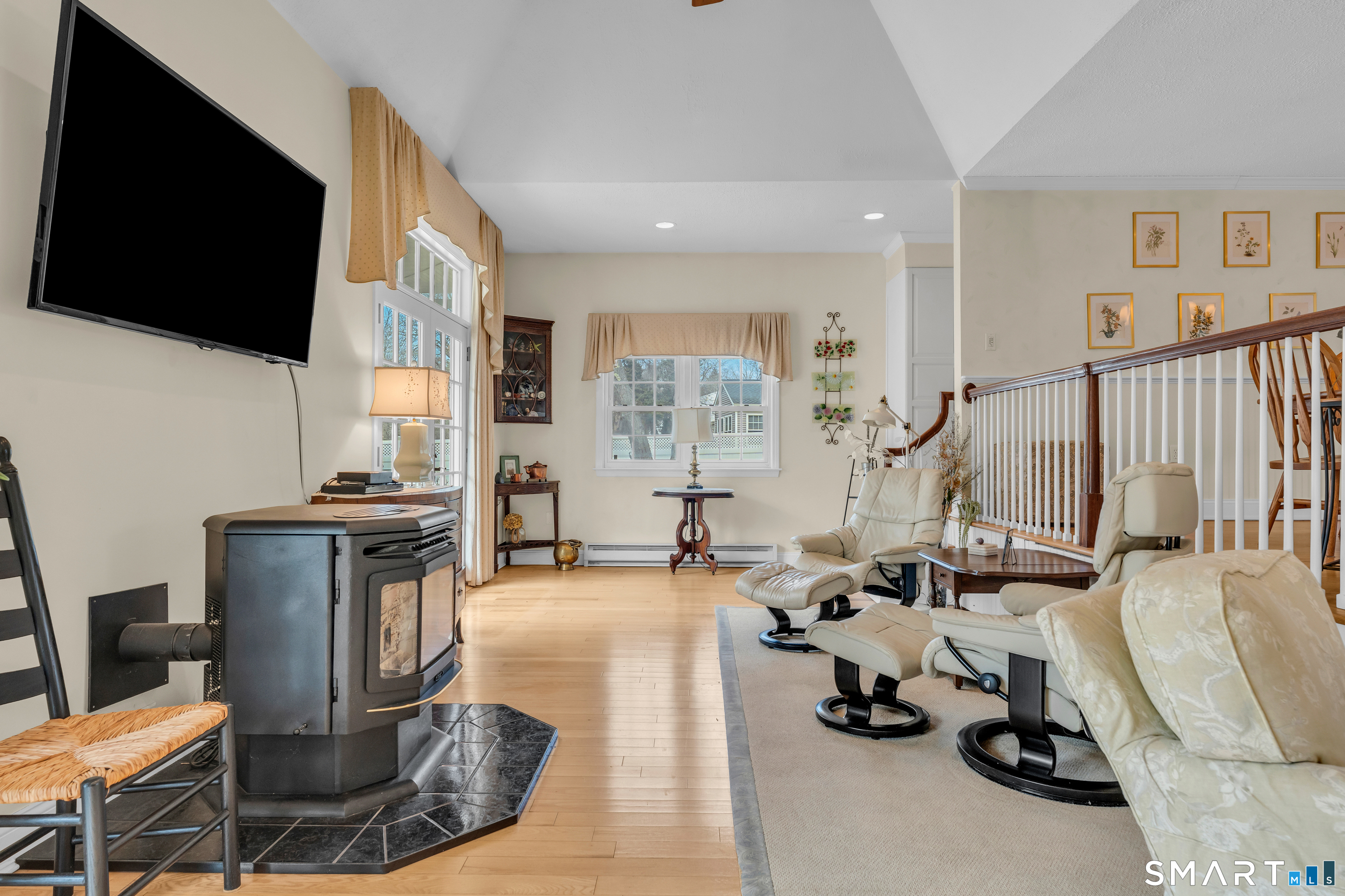 110 Nut Plains Road Guilford, CT 06437 - Photo 10 of 40 Soaring ceilings, sun filled French doors, and space for everything life brings. The family room lives as large as it looks.